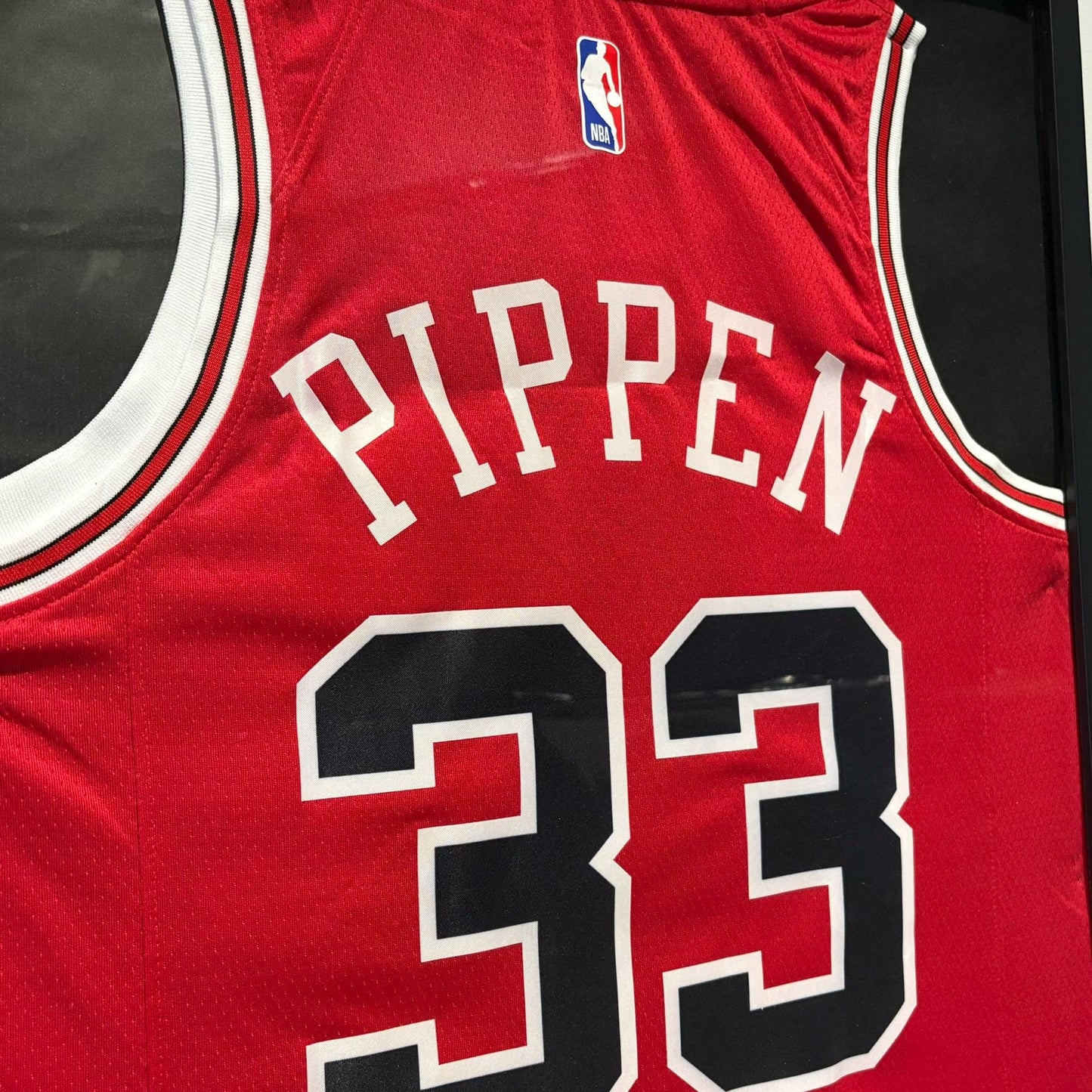 a red jersey with the number 32 on it